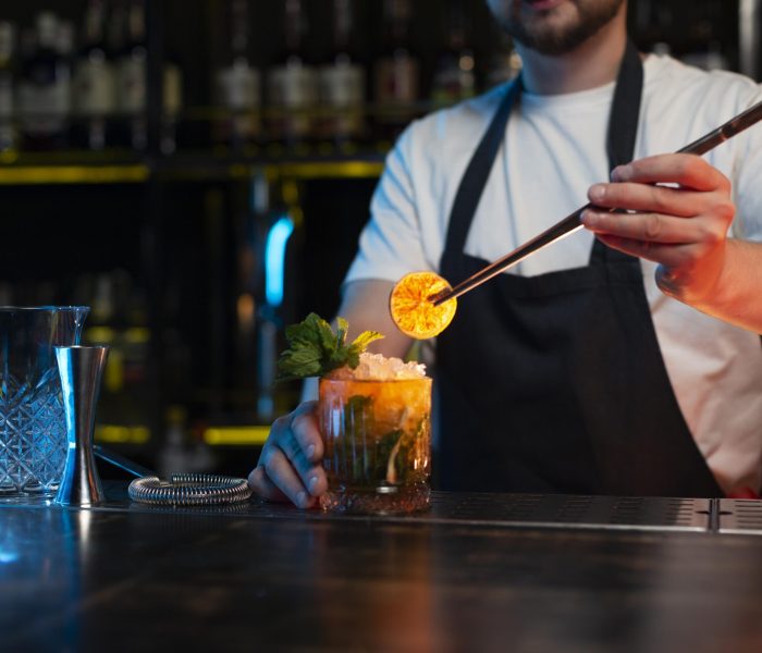 bartender-making-delicious-refreshing-cocktail